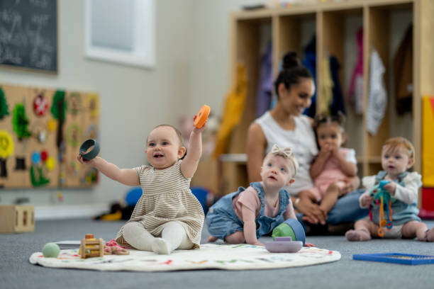 Children participating in a infants classroom activity