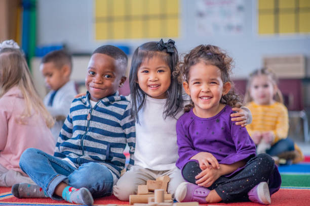 School-age children sitting together in an after-school learning environment